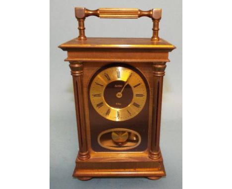 A carriage clock, in a four pillar brass case, 19 cm high