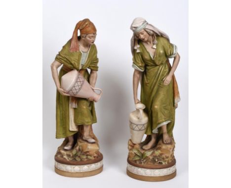 A large pair of Royal Dux figures, of water carriers, 999, 60.5 cm high, and 1000, 61.5 cm high (2)  See illustration Conditi