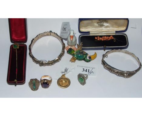 A yellow coloured metal and amethyst ring, a yellow coloured metal medallion, two silver bangles, other jewellery, and a Here