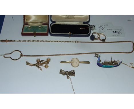 A diamond and sapphire stick pin, a watch chain, brooches, rings and other jewellery