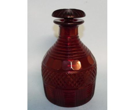 A ruby cut glass decanter and stopper, 20 cm high