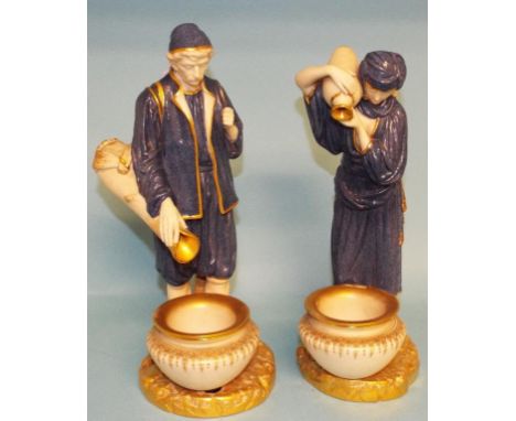 A pair of Royal Worcester figures, of water carriers, 594, the largest 31 cm high (both cracked) (2)