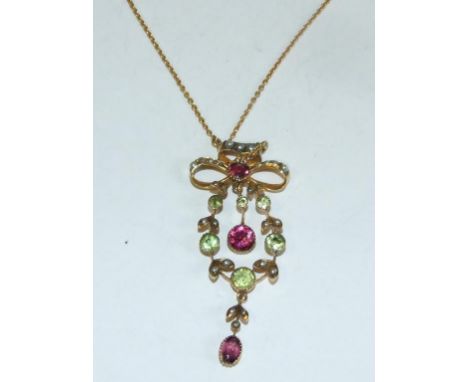 A 9ct gold, amethyst, peridot and seed pearl pendant, on a yellow coloured metal chain