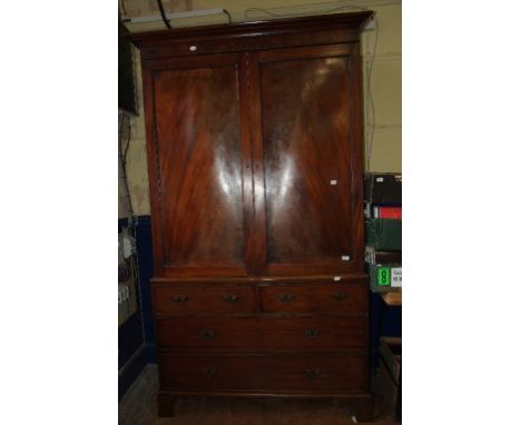 A 19th century mahogany linen press, adapted for hanging, having a pair of panel doors above two short and two long drawers, 