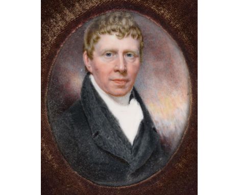 A 19th century oval bust portrait miniature, a gentleman wearing a frock coat and white cravat, watercolour on ivory, 6.5 x 5