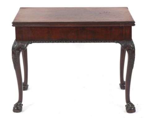 An 18th century Irish style mahogany card table, on leaf and cartouche carved cabriole legs with claw and ball feet, 87 cm wi