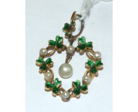 A yellow coloured metal, enamel and seed pearl heart shaped pendant