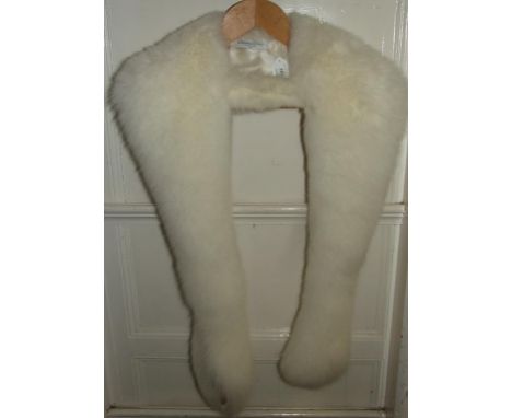 A lady's white fur stole, bears a Christian Dior label Condition report Report by NG

In good clean condition.  Has been well