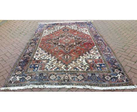 A Persian Heriz carpet, 293 x 204 cm