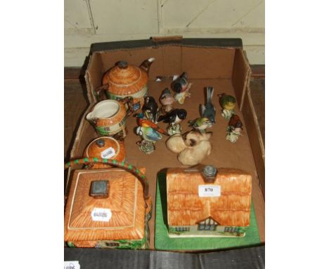 A Beswick Ware Cottage three piece tea service, 240, 1115 and 1128, a similar biscuit barrel and cover, and a cheese dish and