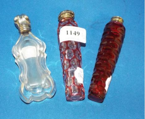 A clear and flashed ruby glass scent bottle, S Mordan and Co, 11 cm high, and two other scent bottles (a.f.) (3)