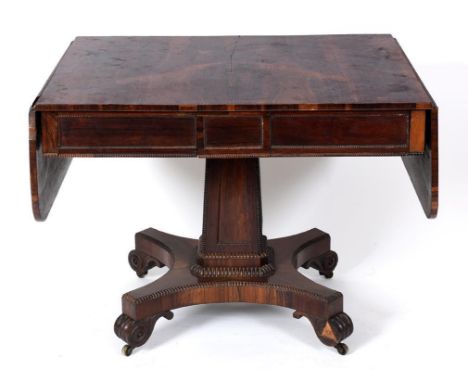 An early Victorian rosewood sofa table, on a tapering square column, concave sided platform base, and scroll toes, 149 cm wid