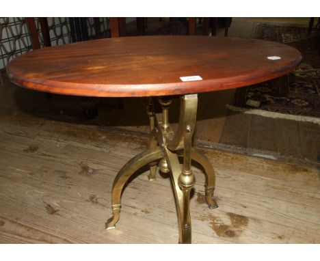 A 19th century brass stand, possibly for a globe, with a later mahogany top, 69 cm wide, a 19th century steel fender, a print