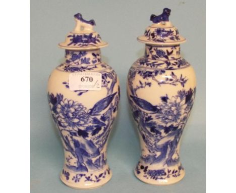 A pair of Chinese baluster vases and covers, 21 cm high (2) Condition report Report by NG

One lid with chips to rim and rubb