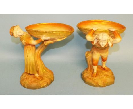 A pair of Royal Worcester porcelain centrepieces, of figures supporting baskets, 962 & 963, the largest 21 cm high (a.f.) (2)