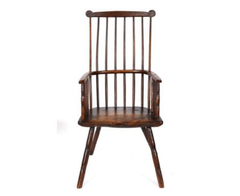 A Windsor style kitchen stick back armchair, on ring turned legs  See inside back cover colour illustration Condition report 