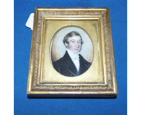 An oval bust portrait miniature of a gentleman wearing a white cravat, watercolour, 5.5 x 4 cm