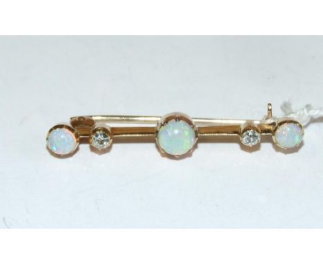 An opal and diamond bar brooch, in a yellow coloured metal mount