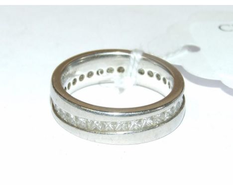 A platinum and princess cut diamond eternity ring  Condition report Report by NG

Approx. ring size L ½

Light wear and in ne