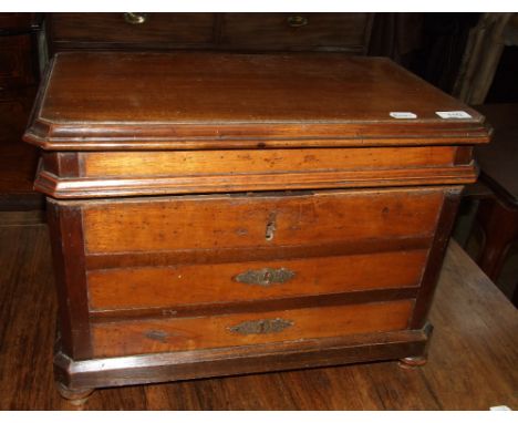 A 19th century French box, in the form of a commode chest of drawers, on bun feet, 55 cm wide
