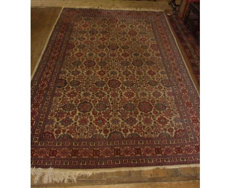 A Persian carpet, with flowerhead and other motifs within a multi border, 243 x 350 cm Condition report Report by NG

Large p