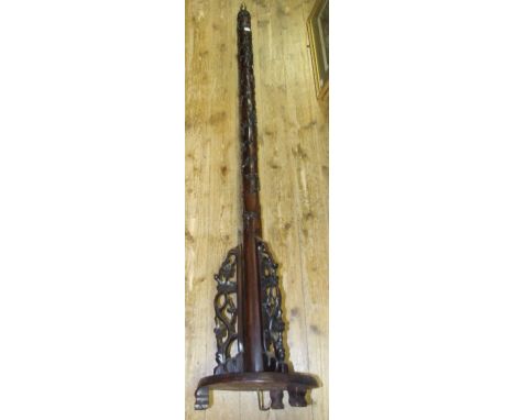 A Chinese hardwood standard lamp, carved prunus