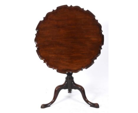 A George III style mahogany tripod table, the pie crust top on a vase turned column, 77 cm wide  See illustration