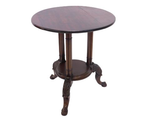 A mahogany occasional table, in Chippendale style, the circular top on three cluster column supports, with a moulded platform