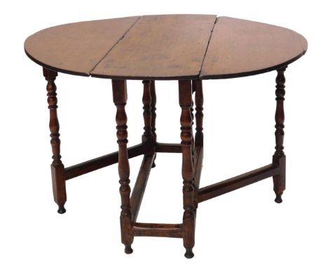 An 18thC oak oval gate leg table, on turned supports, 90cm wide. 