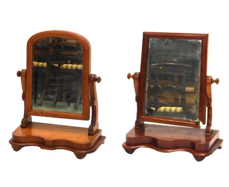 Two dressing table mirrors, a late 19thC mahogany swing frame dressing table mirror, the arch top above a shelf and splayed b