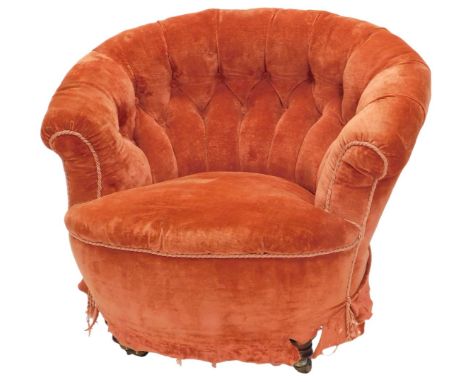 A Victorian mahogany tub shaped chair, with button padded back and seat, on turned legs with castors. (AF) 