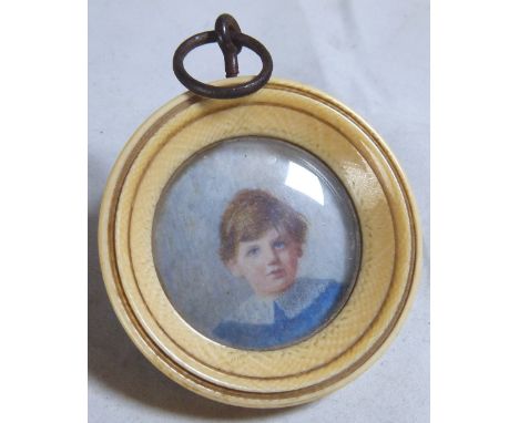 ANTIQUE PORTRAIT MINIATURE. Antique portrait miniature watercolour of a young boy in a circular ivory frame, unsigned  D - 5 