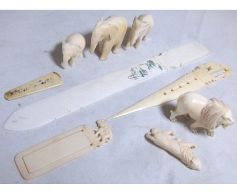 ANTIQUE IVORY ITEMS. Ivory elephants lions and bookmarks