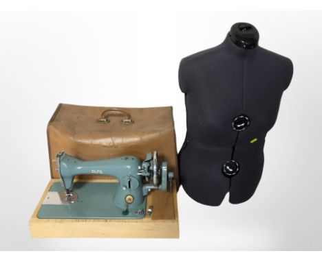 An adjustable dress maker's mannequin torso and an Alfa hand sewing machine 