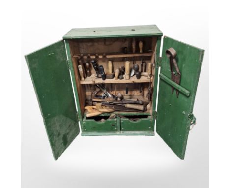 A painted pine tool cabinet containing assorted carpentry tools, chisels, hand saws, Stanley No. 4 plane, etc., cabinet 75cm 