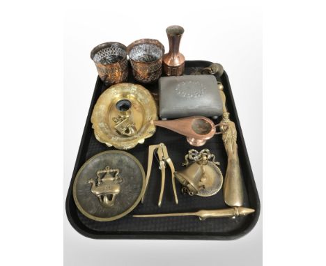 A group of metal wares including a pair of Arts and Crafts embossed and pierced copper pots, brass ornaments, copper oil lamp
