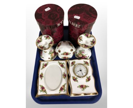 A pair of Royal Albert Old Country Roses porcelain candlesticks, boxed, further hexagonal trinket box, a photograph frame and