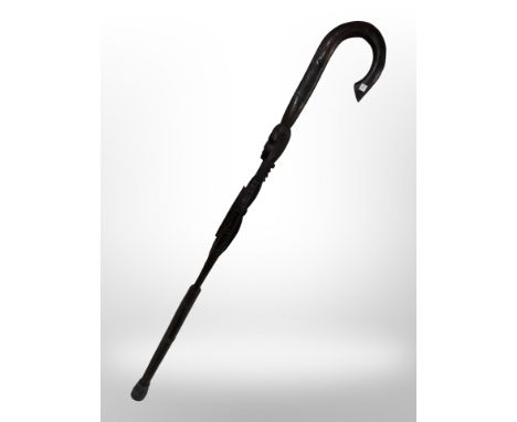 An African carved figural walking stick.