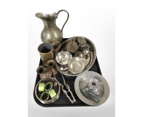 A collection of metal wares, pewter chamber stick, silver-plated gallery tray and further vessels, nutcracker, napkin rings, 