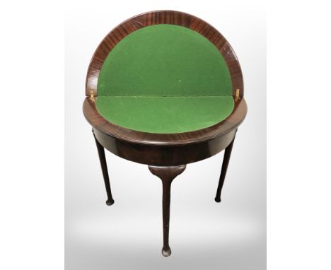 A mahogany demi lune card table on pad feet, width 75 cm