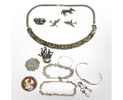 A collection of silver jewellery including pair of aeroplane cuff links, panelled necklace, bangles, filigree bracelets, Celt