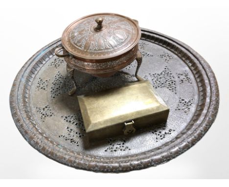 A 19th-century Indian embossed copper tripod food-warming dish, an oriental engraved brass cigarette box, and a 19th-century 
