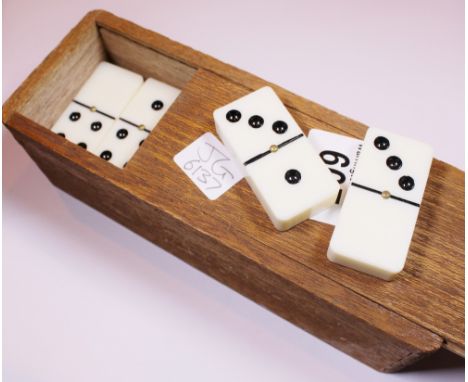 VINTAGE DOMINOES. Box of vintage dominoes with brass spinners