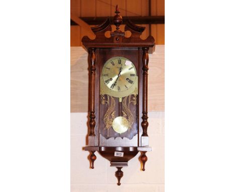 CHIMING WALL CLOCK. Wooden cased 31 day chiming wall clock, H: 81 cm