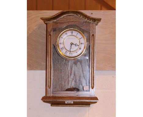 WESTMINSTER CLOCK. Oak cased Westminster chime wall clock