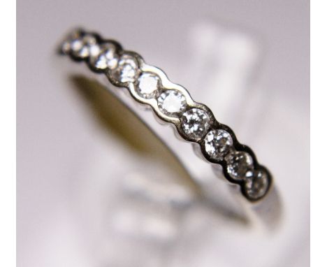 DIAMOND HALF ETERNITY. 18 ct white gold 0,25 ct diamond half eternity ring, size M