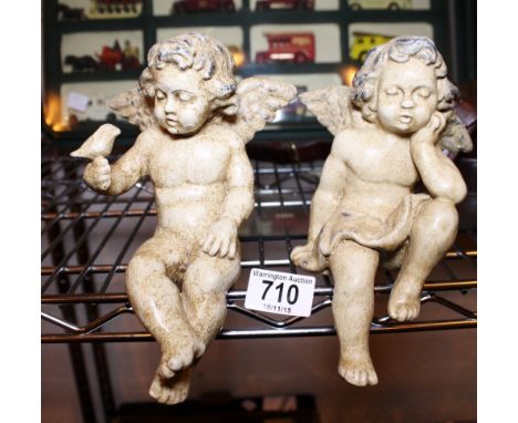 CERAMIC CHERUBS. Pair of ceramic sleeping cherubs