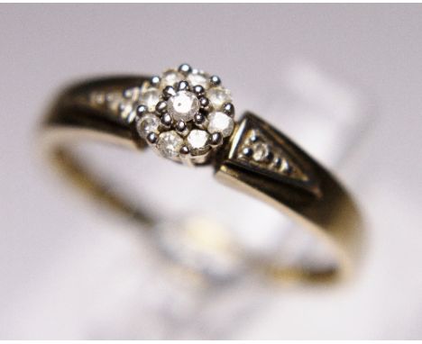 9 CT GOLD DIAMOND RING. 9 ct gold diamond flower ring, size M/N