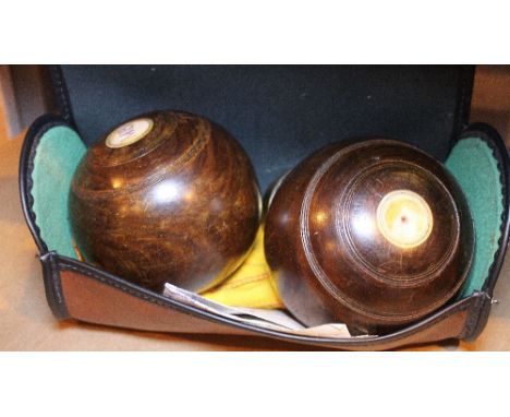 CROWN GREEN BOWLS. Pair of vintage cased crown green bowls