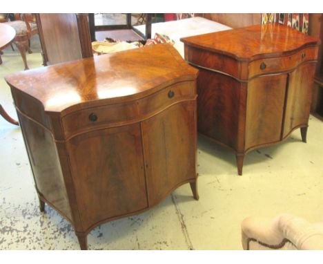 SIDE CABINETS, a pair, early 20th century serpentine fronted mahogany and ebony string inlaid with a frieze drawer over two p